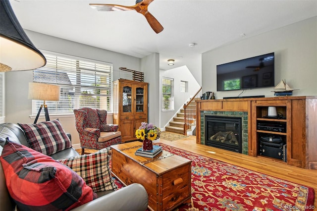 3240 Spruce St, Denver, CO 80238 - living room featuring wood finished floors, a ceiling fan, healthy amount of natural light, and stairway