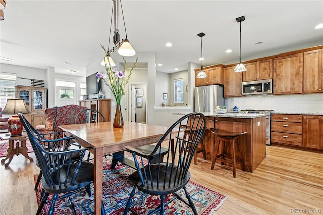 3240 Spruce St, Denver, CO 80238 - dining area with light wood finished floors and recessed lighting