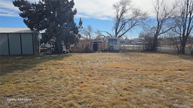 view of yard with a storage shed