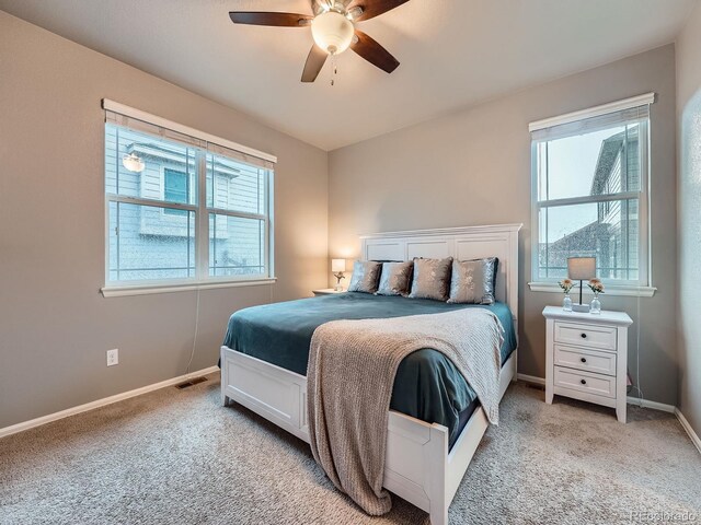 22466 E Layton Cir, Aurora, CO 80015 - bedroom with light carpet, baseboards, and a ceiling fan