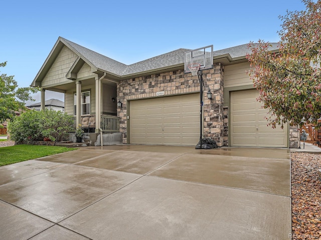 22466 E Layton Cir, Aurora, CO 80015 - ranch-style house featuring stone siding, a garage, concrete driveway, a shingled roof, and covered porch