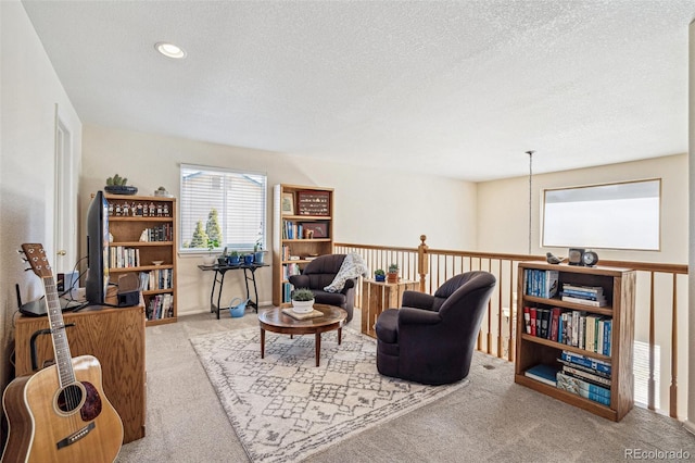 living room featuring recessed lighting, a textured ceiling, and carpet flooring