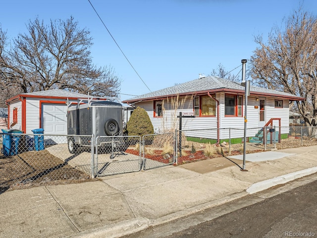 view of front of house featuring a garage and an outdoor structure