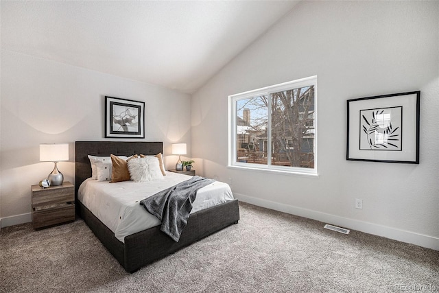 bedroom featuring lofted ceiling and carpet flooring