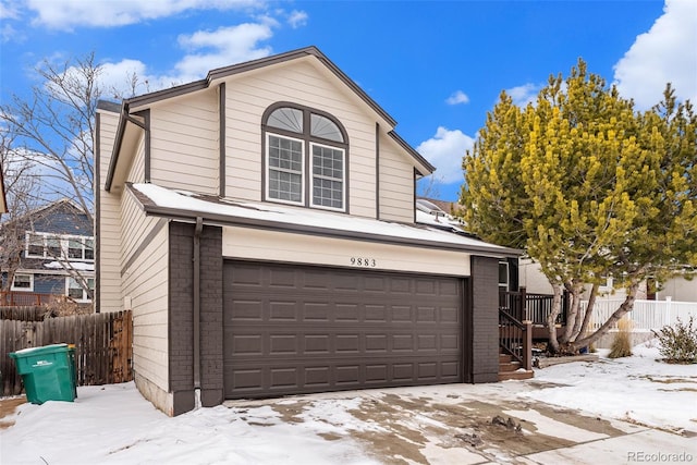 front facade with a garage