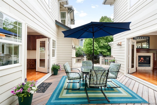6032 Umber St, Arvada, CO 80403 - wooden deck with outdoor dining area