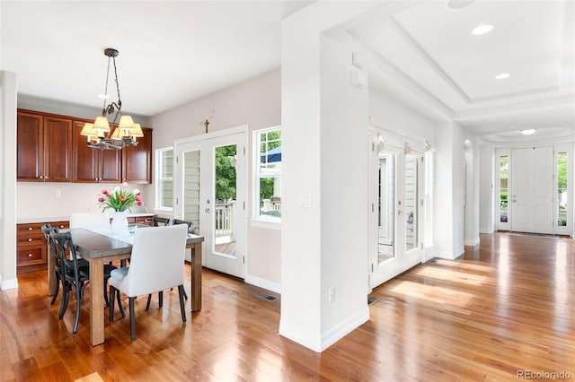 6032 Umber St, Arvada, CO 80403 - dining space with plenty of natural light, light wood-type flooring, baseboards, and recessed lighting