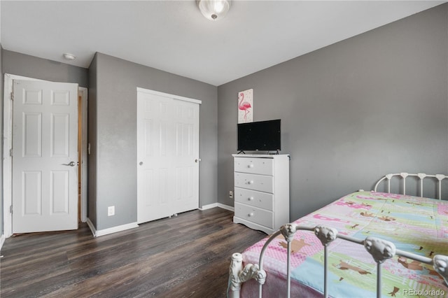 13664 Linden Ct, Thornton, CO 80602 - bedroom featuring dark wood-style flooring, baseboards, and a closet
