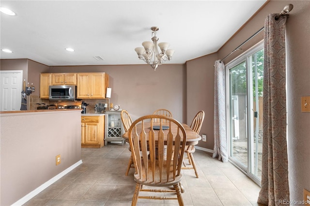 13664 Linden Ct, Thornton, CO 80602 - dining space with baseboards, light tile patterned floors, a chandelier, and recessed lighting