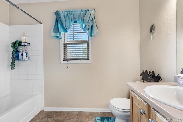 13664 Linden Ct, Thornton, CO 80602 - bathroom with baseboards, toilet, vanity, bathtub / shower combination, and tile patterned flooring