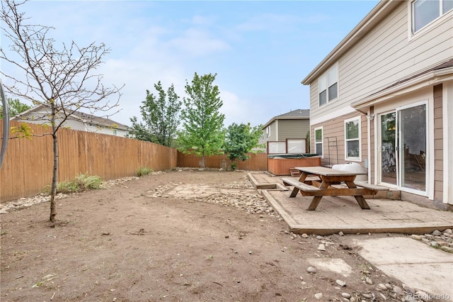 13664 Linden Ct, Thornton, CO 80602 - fenced backyard featuring a hot tub and a patio area