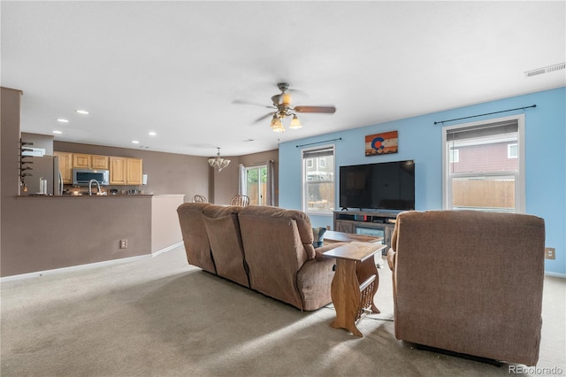 13664 Linden Ct, Thornton, CO 80602 - carpeted living room featuring ceiling fan, recessed lighting, baseboards, and a chandelier