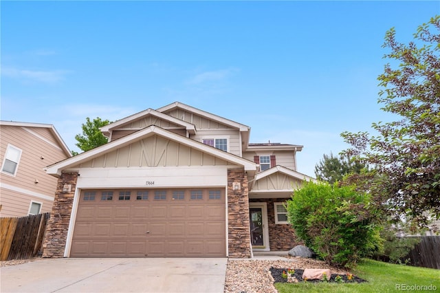 13664 Linden Ct, Thornton, CO 80602 - view of front of house with board and batten siding, stone siding, driveway, and an attached garage