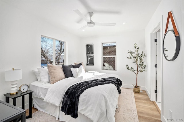 bedroom featuring ceiling fan and light wood-type flooring