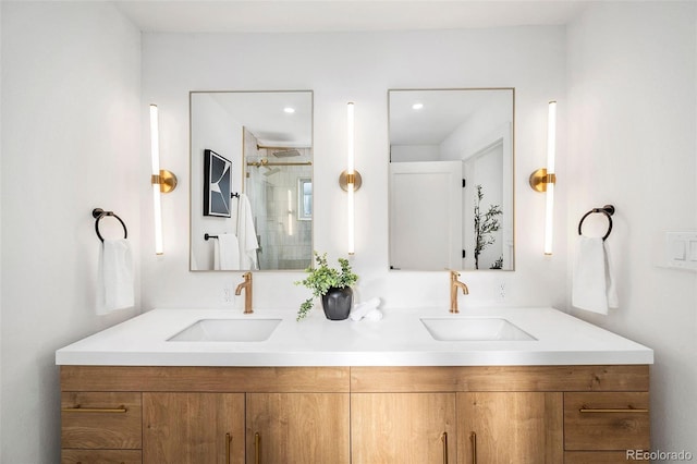 bathroom with vanity and a shower with shower door