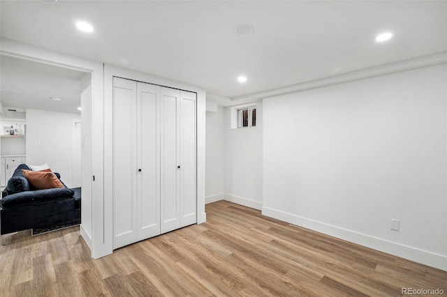 bedroom featuring a closet and light hardwood / wood-style floors