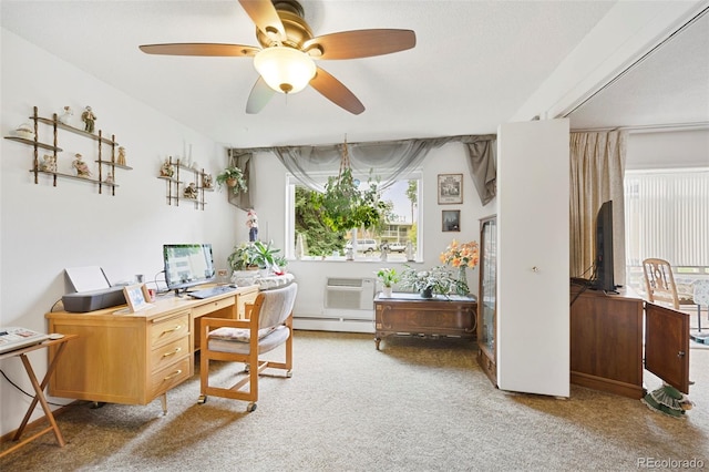 carpeted home office with a baseboard heating unit and ceiling fan