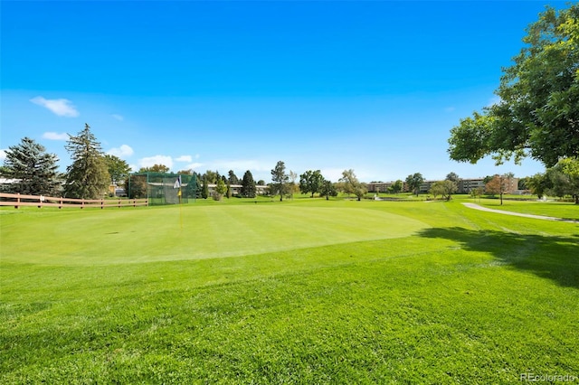 view of property's community with a yard