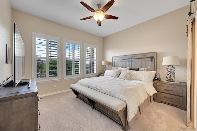 bedroom featuring baseboards, light carpet, and ceiling fan