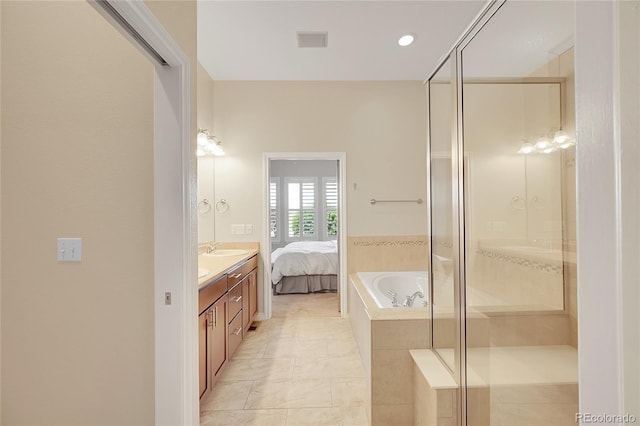 ensuite bathroom featuring vanity, a shower stall, tile patterned floors, and connected bathroom