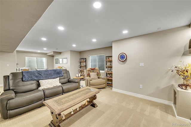 living area with light colored carpet, recessed lighting, and baseboards