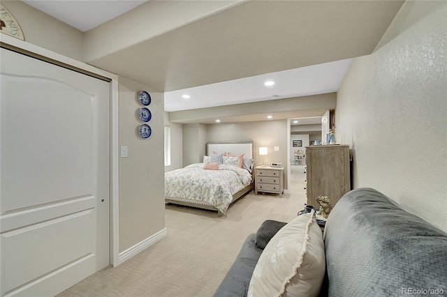 bedroom featuring light colored carpet, recessed lighting, and baseboards