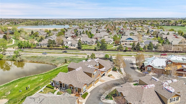 birds eye view of property featuring a water view and a residential view