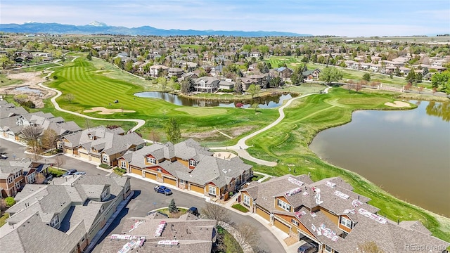 bird's eye view with view of golf course, a residential view, and a water and mountain view