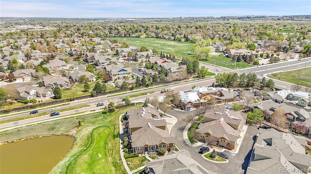 bird's eye view with a water view and a residential view