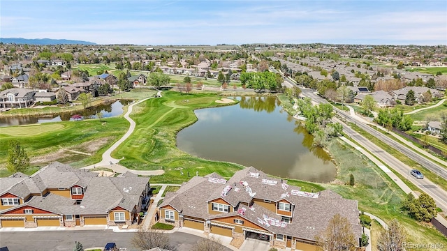 birds eye view of property featuring a water and mountain view, golf course view, and a residential view