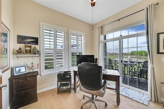 office area featuring baseboards and wood finished floors