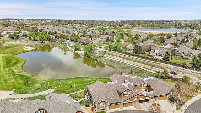 aerial view featuring a water view and a residential view