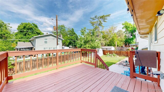 6631 Welch Ct, Arvada, CO 80004 - wooden deck with a fenced backyard