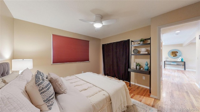 6631 Welch Ct, Arvada, CO 80004 - bedroom featuring light wood-type flooring, a ceiling fan, and baseboards