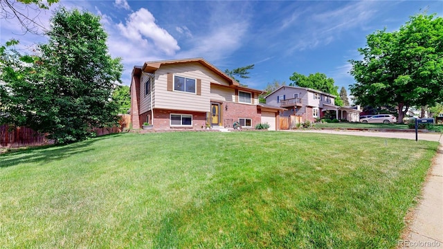 6631 Welch Ct, Arvada, CO 80004 - split foyer home featuring brick siding and driveway