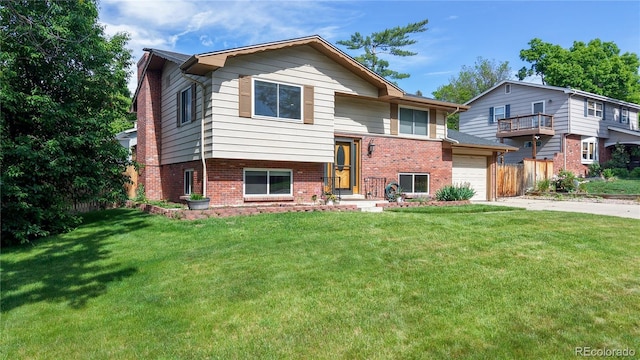 6631 Welch Ct, Arvada, CO 80004 - split foyer home with brick siding and driveway
