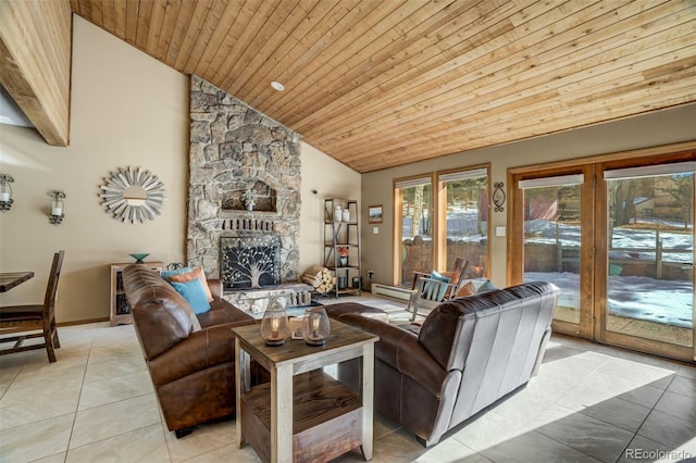 320 Morning Sun Dr, Woodland Park, CO 80863 - living room featuring plenty of natural light, a fireplace, light tile patterned flooring, wood ceiling, and baseboard heating
