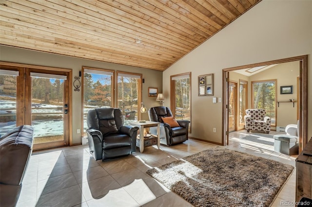 320 Morning Sun Dr, Woodland Park, CO 80863 - living room featuring tile patterned flooring, healthy amount of natural light, high vaulted ceiling, wood ceiling, and baseboards