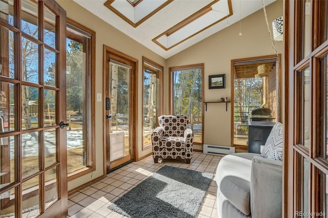 320 Morning Sun Dr, Woodland Park, CO 80863 - sunroom / solarium featuring vaulted ceiling, baseboard heating, tile patterned flooring, french doors, and a skylight