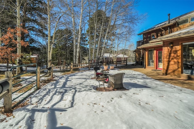 320 Morning Sun Dr, Woodland Park, CO 80863 - yard layered in snow with fence and a patio area