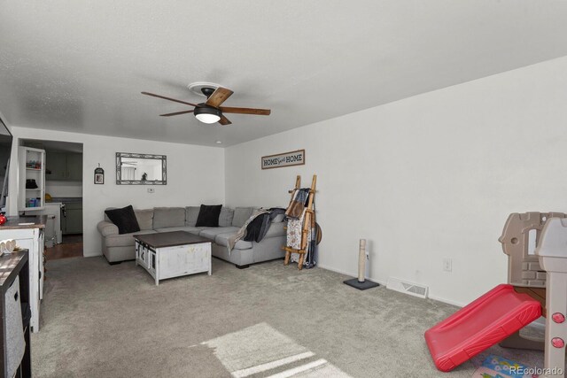 living room with light carpet and ceiling fan