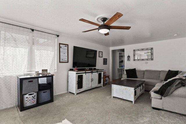 living room with light carpet and ceiling fan