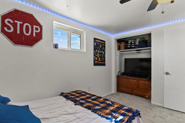 bedroom with a closet, ceiling fan, and carpet floors