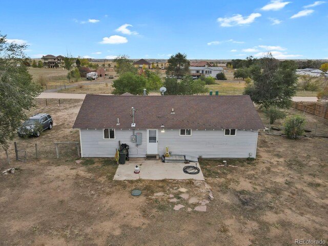 rear view of property featuring a patio area