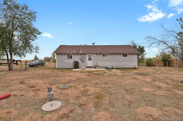 back of property featuring a patio