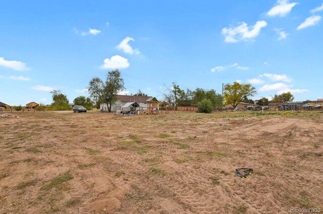 view of yard with a rural view