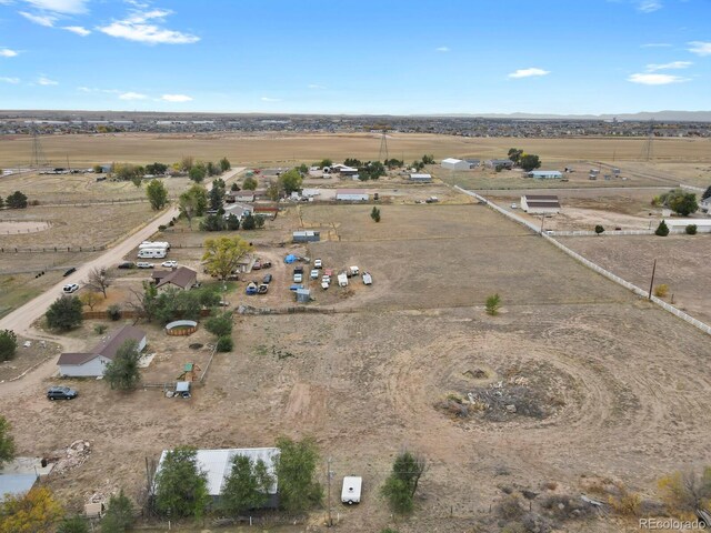 birds eye view of property featuring a rural view