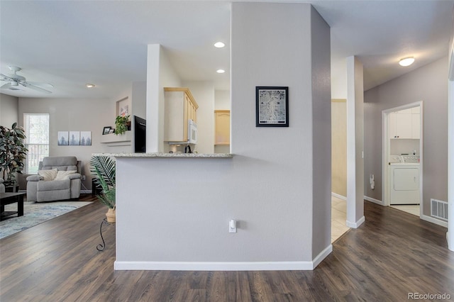 3993 S Dillon Way Unit 104, Aurora, CO 80014 - kitchen featuring washing machine and clothes dryer, ceiling fan, dark wood finished floors, white microwave, and recessed lighting