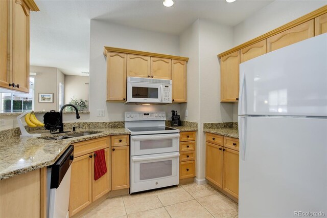 3993 S Dillon Way Unit 104, Aurora, CO 80014 - kitchen featuring white appliances, a sink, light brown cabinetry, light stone countertops, and light tile patterned floors