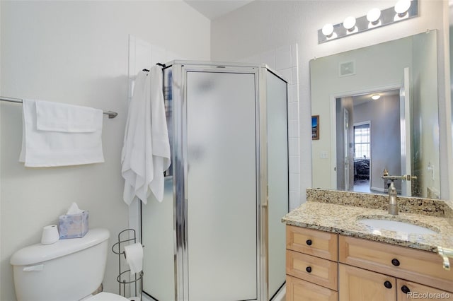 3993 S Dillon Way Unit 104, Aurora, CO 80014 - full bathroom featuring a shower stall, vanity, and toilet
